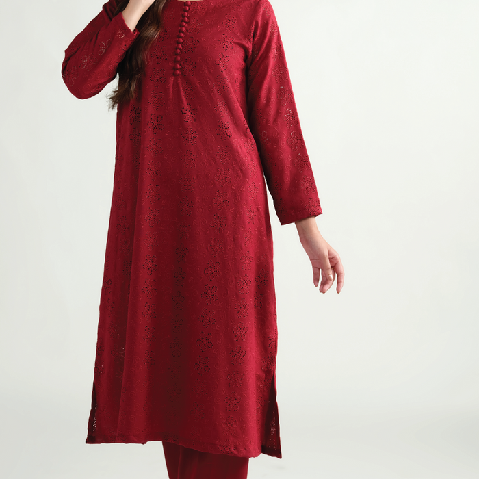 Sinoor's 'Zarine' red schiffli pret suit from the Winter Basic Collection. Features an A-line kurta and matching trousers. Ready-to-wear for women.