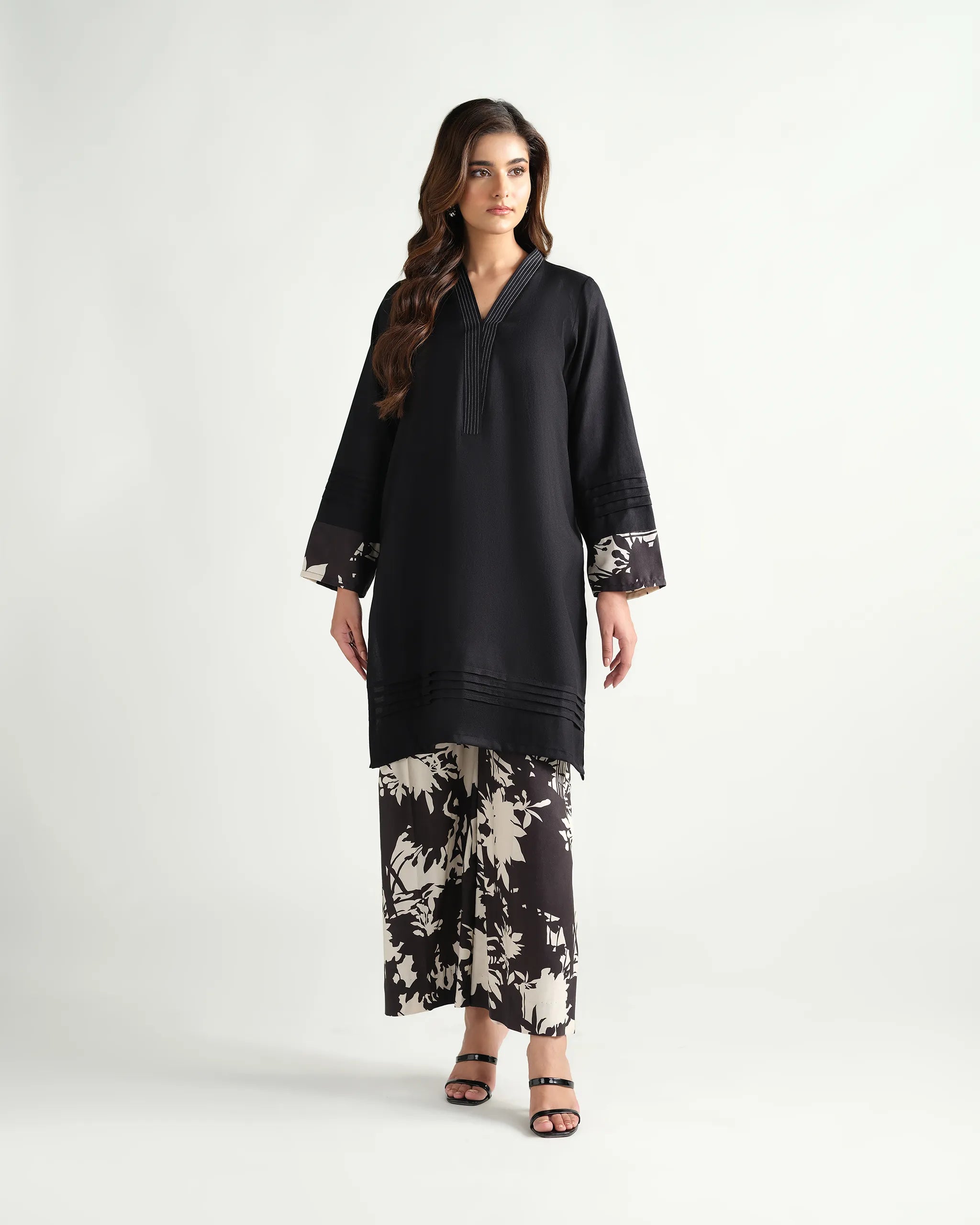 The 'Roha' by Sinoor: an elegant black ready-to-wear kurta and printed trouser set from our Winter '25 Basic Collection. Perfect for everyday style.