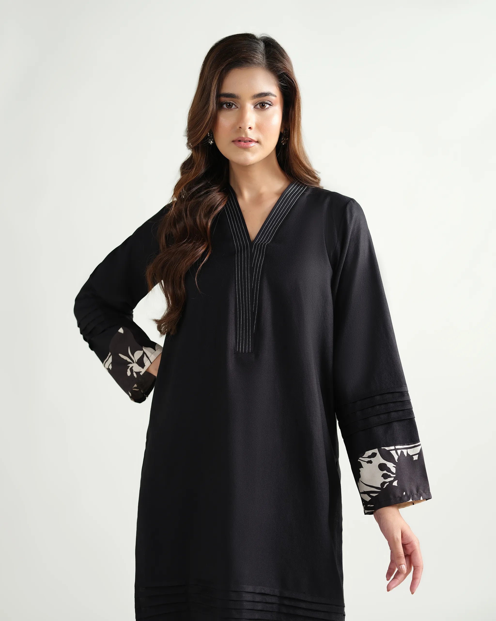 The 'Roha' by Sinoor: an elegant black ready-to-wear kurta and printed trouser set from our Winter '25 Basic Collection. Perfect for everyday style.