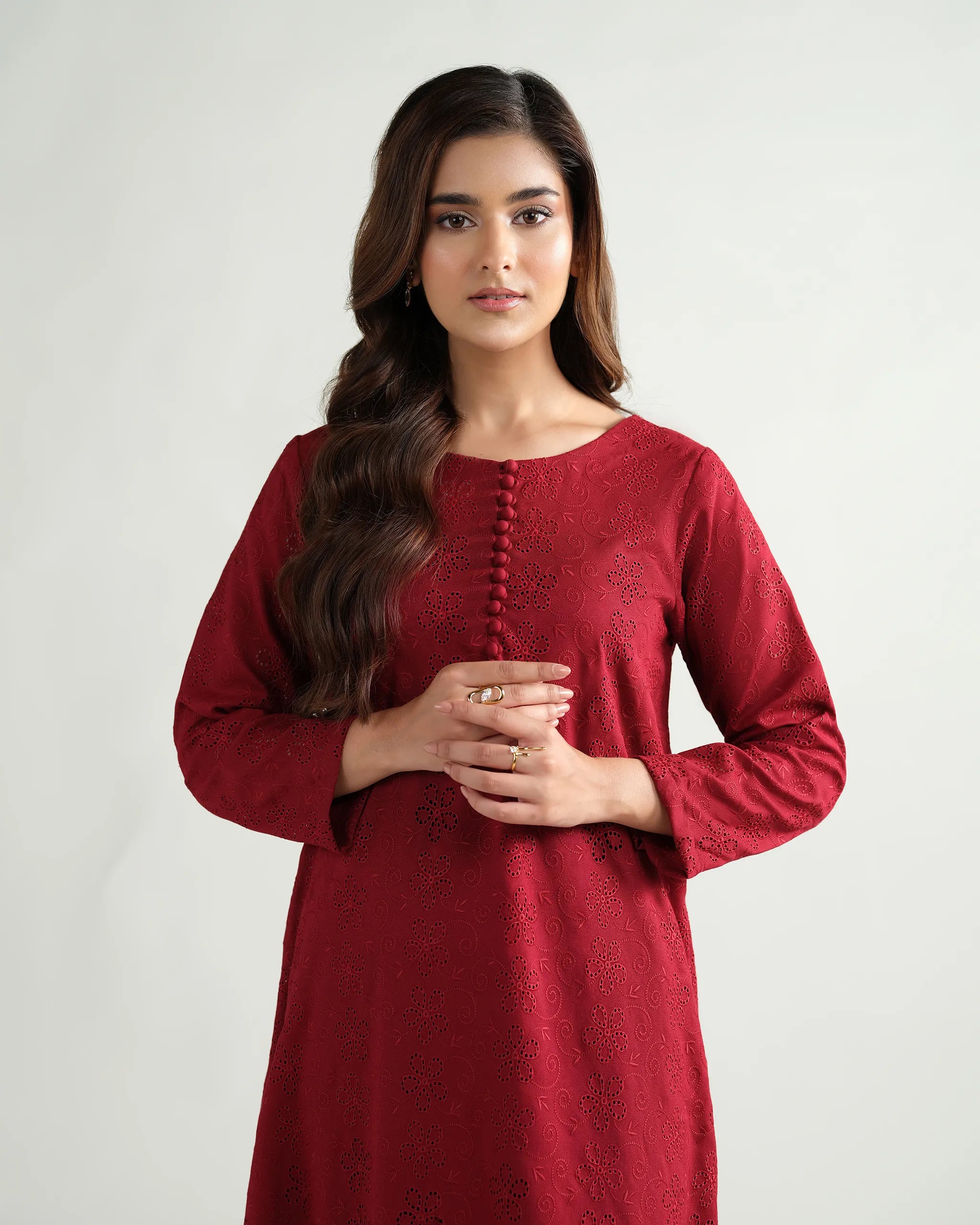 Sinoor's 'Zarine' red schiffli pret suit from the Winter Basic Collection. Features an A-line kurta and matching trousers. Ready-to-wear for women.