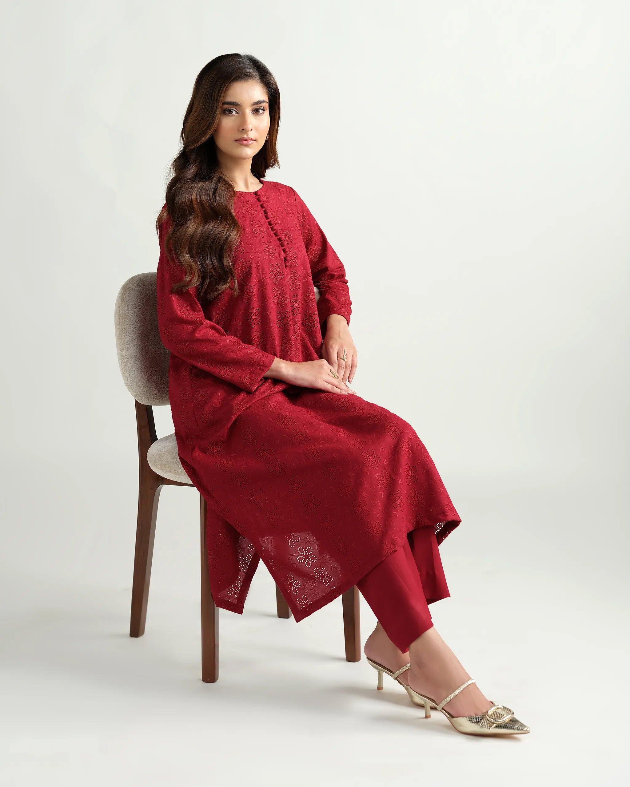 Sinoor's 'Zarine' red schiffli pret suit from the Winter Basic Collection. Features an A-line kurta and matching trousers. Ready-to-wear for women.