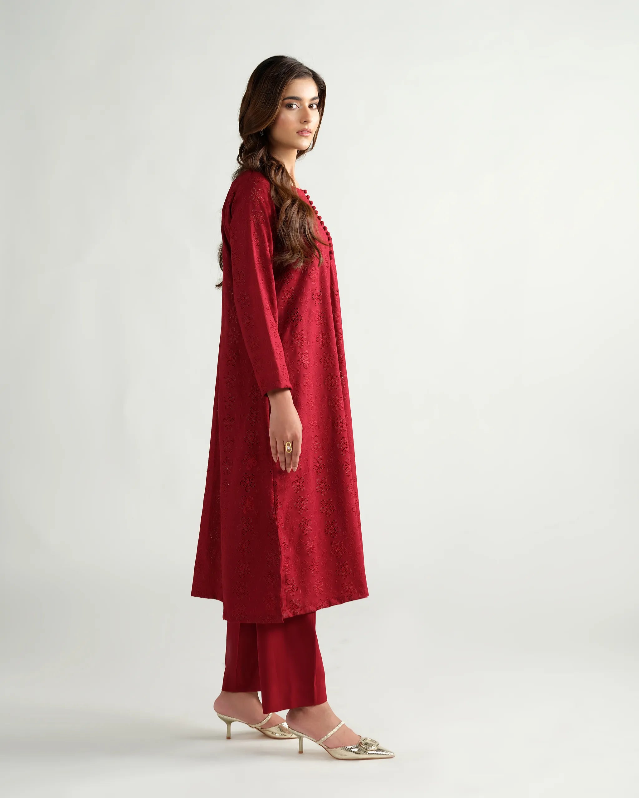 Sinoor's 'Zarine' red schiffli pret suit from the Winter Basic Collection. Features an A-line kurta and matching trousers. Ready-to-wear for women.