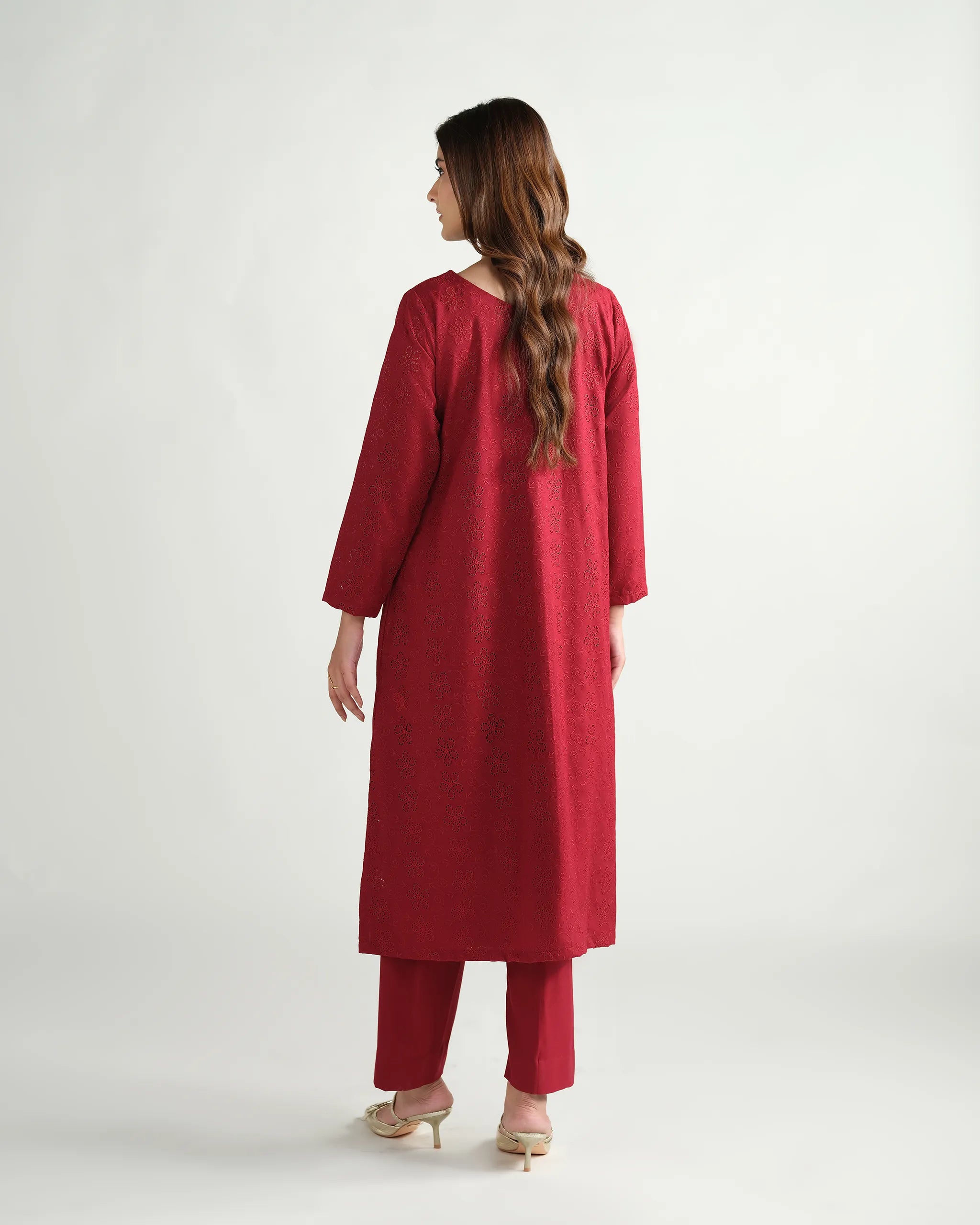 Sinoor's 'Zarine' red schiffli pret suit from the Winter Basic Collection. Features an A-line kurta and matching trousers. Ready-to-wear for women.